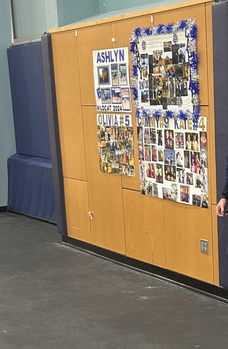 Photo of signs made for the senior volleyball players on senior night. Cammy and Kate Gore, Mary Mathews, Ashlyn Hartford, and Olivia Lyons are seniors who will be graduating in 2024. 