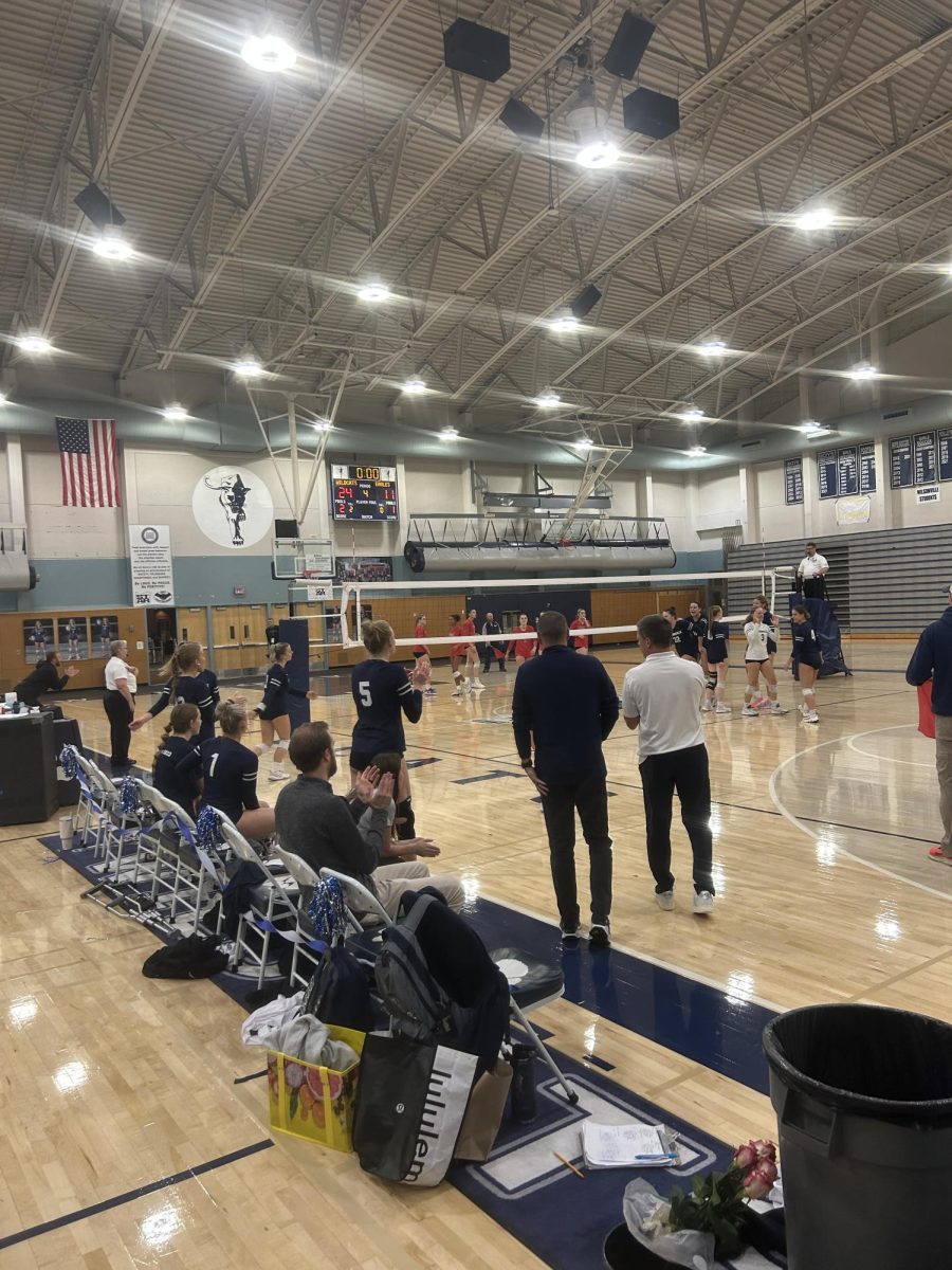 The sideline is seen cheering after Wilsonville scores another point. Only one more point needed to be scored for Wilsonville to win the game.