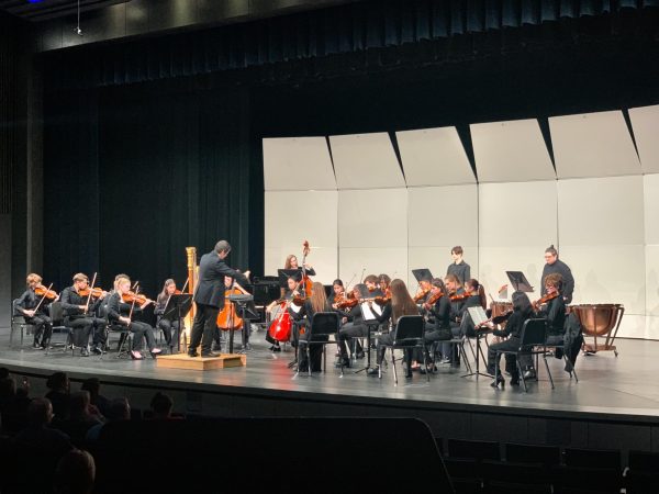 The chamber orchestra begins their section of the performance. Conducted by Mr. Davies and Mr. Gardner, these selective students unite in harmony to entertain and envelope audiences through instrumental music. 
