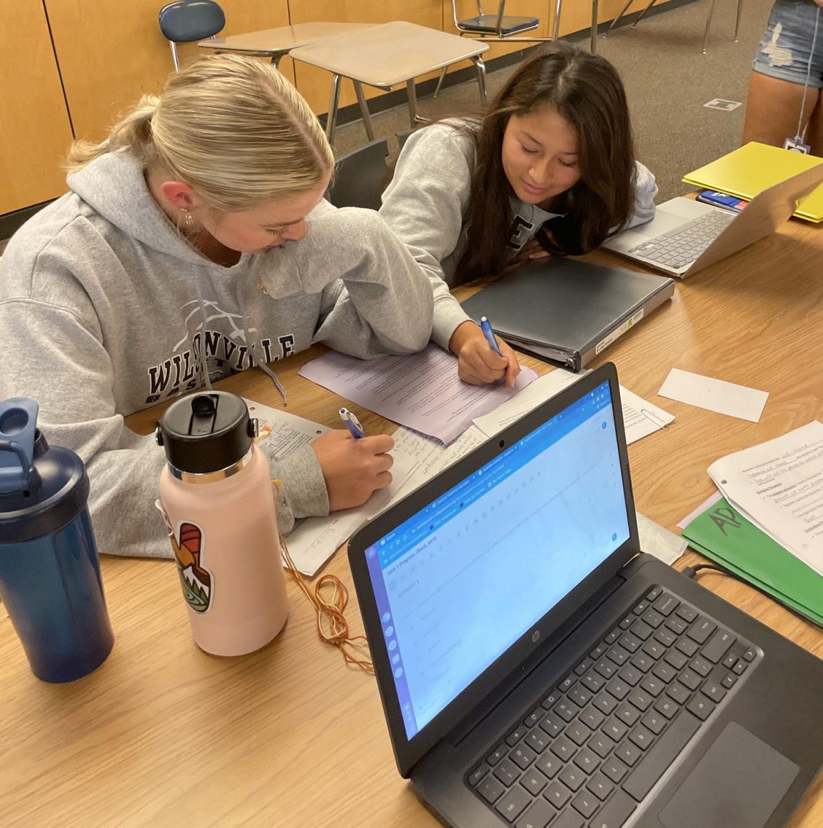 Two Wilsonville students study diligently for their current classes. PSATs and SATs add on to the workload students already have.