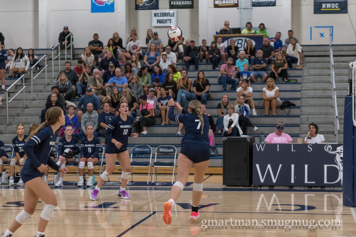 Ellis passes the ball to Emma Fauth in the season opener. The girls team has an outstanding record, and the potential boys team will have a lot to live up to. Photo provided by Greg Artman.