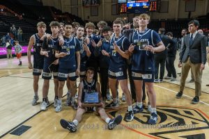 The Wilsonville basketball team poses for a picture after winning the 2023 State Championship. Wilsonville took down Summit 43-36 in their second straight title victory.