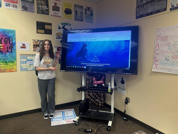 Grace Alameda standing in front of the new The Little Mermaid movie. The movie premiered in theaters on May 26th 2023. 