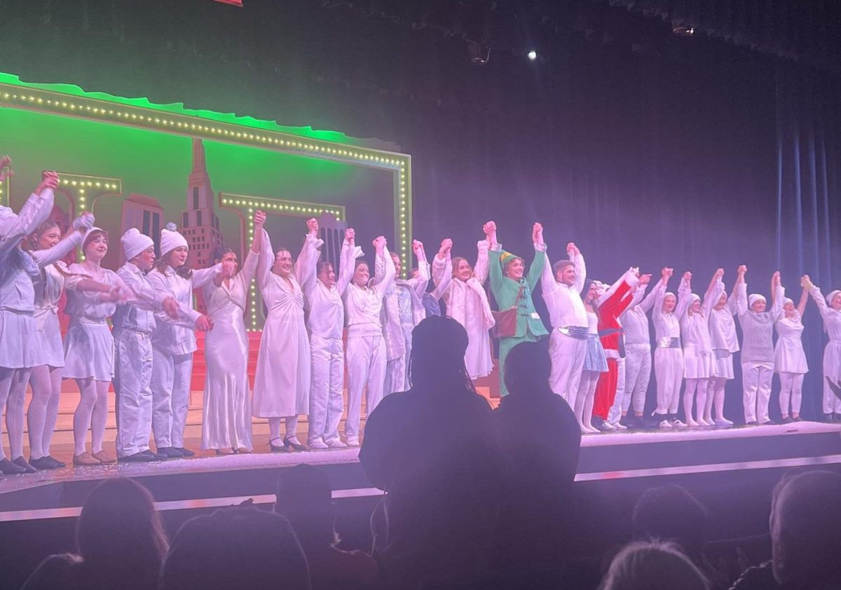 The cast of Elf bows for the audience. They were later greeted with praise and flowers outside the theater. 