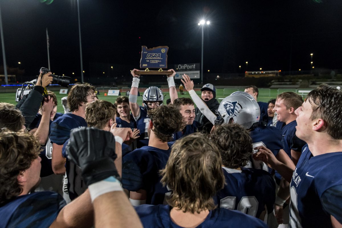 The Wildcat Football team gather around to celebrate the State Championship. It's the school's first since 2004. Photo provided by Greg Artman.