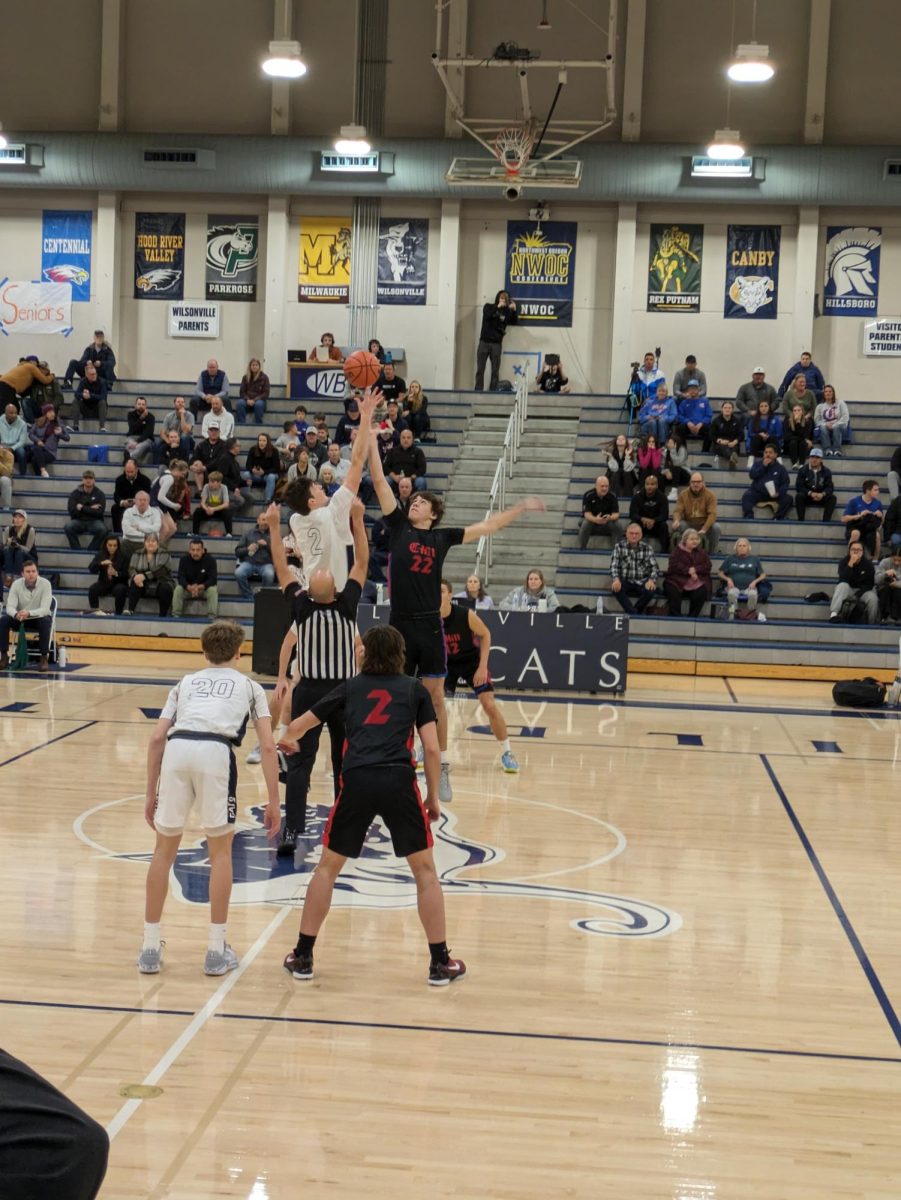 It's go-time! Forward Kyle Counts wins the tip for the Wildcats, and the game begins!