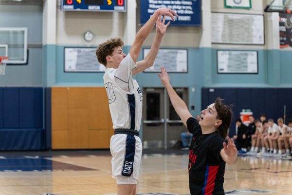 Starting SG Jacob Boss fires a midrange jumper in the first quarter. A junior this year, Boss has impressed in his first season on Varsity. Photo provided by Greg Artman.