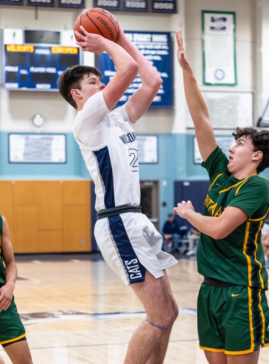 Kyle Counts elevates for a jump shot against Putnam. The Wildcats would take down the Kingsman in a wild overtime game 63-59.