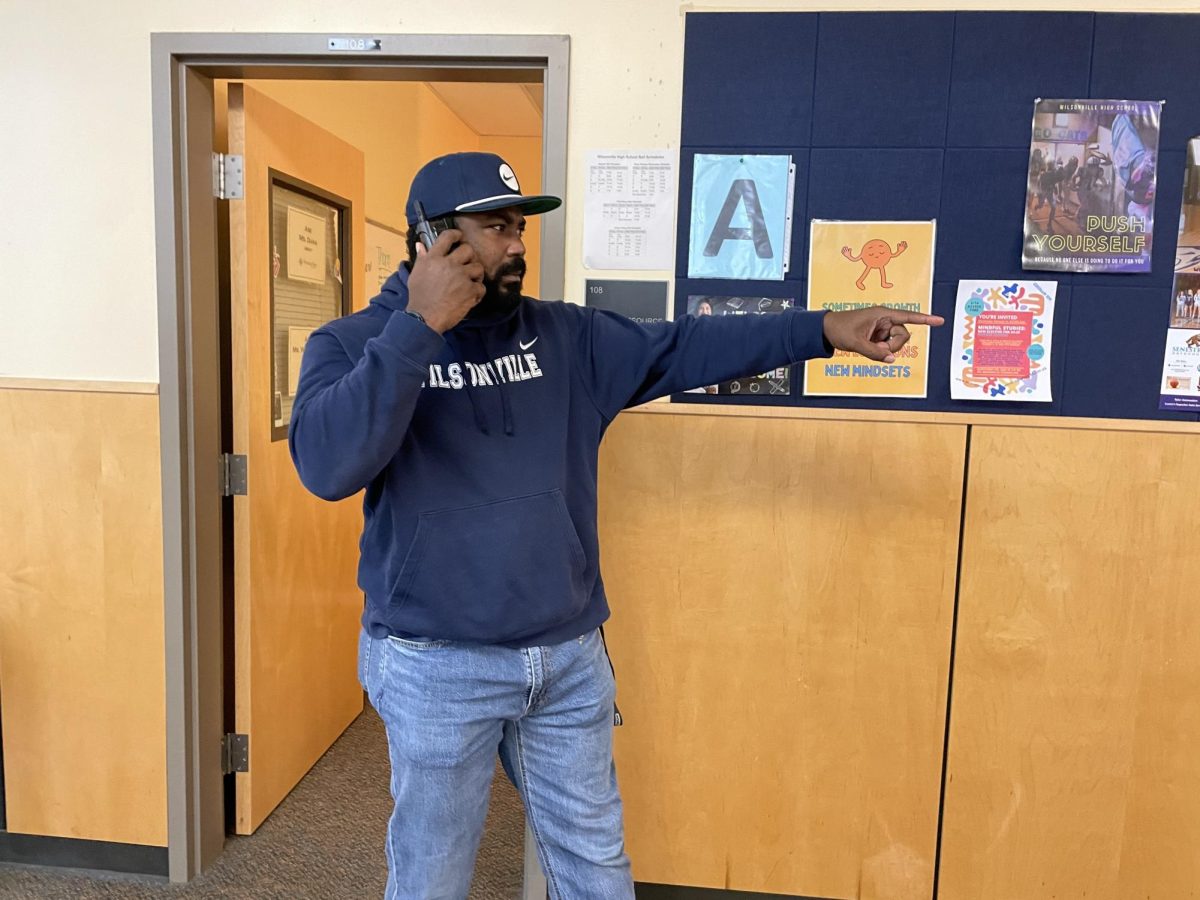 Marcus Washington, the Wilsonville Hall Monitor spots a hoard of roaming students. He became very displeased. 