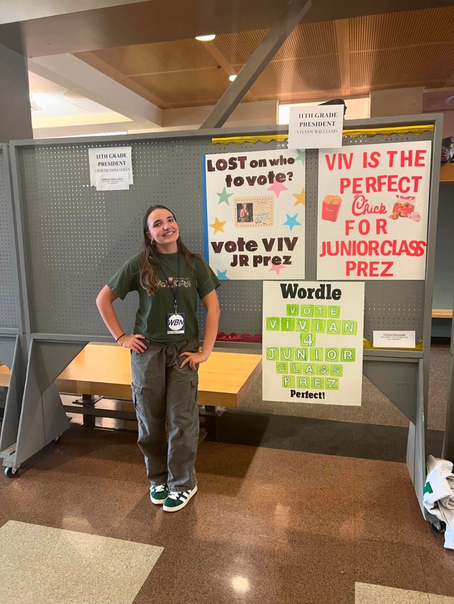 Vivian Williams poses in front of her various campaign posters. Its important to have a fun and interesting campaign. Photo provided by Vivian Williams.