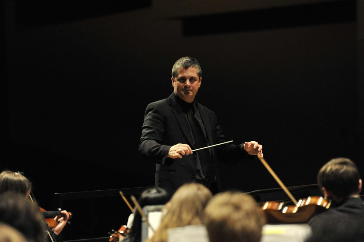 Band and orchestra director Chad Davies conducts his orchestra at the OSAA state orchestra festival. Davies has built one of the most formidable 5A music programs in Oregon.