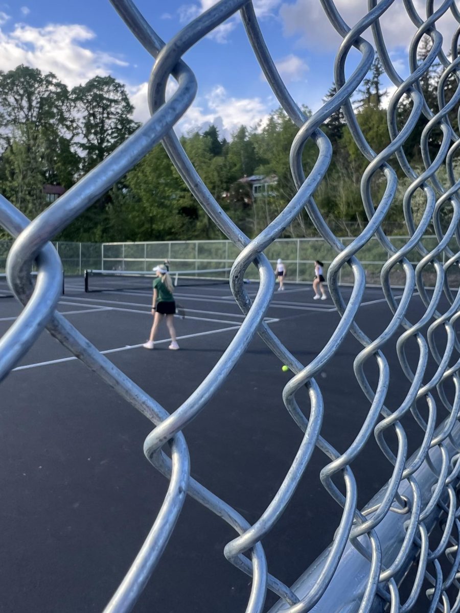 Doubles team, Mia Williams and Kate Kurata get into position for the next point of their match. They were down by two games, but are still battling to stay in the game. 