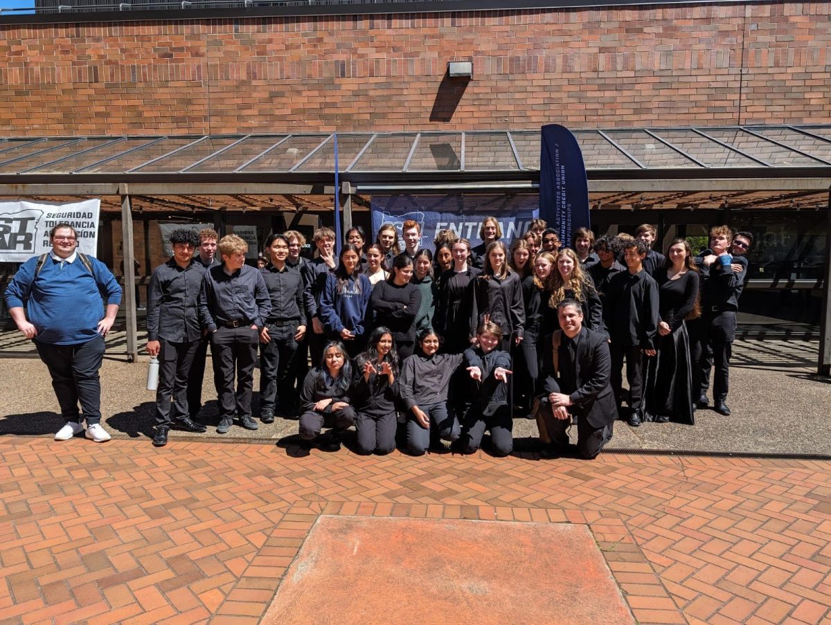 Wilsonville High School's Orchestra poses for the camera after a much deserved win. Their dedication inspires onlookers. Photo provided by Caleb Green.