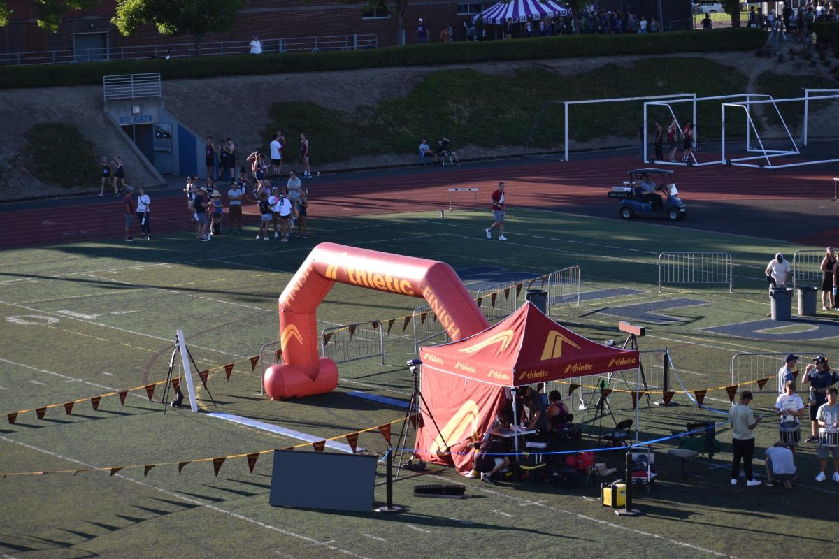 The finish line being set up before the runners take the track. Thanks to the helpers, the meet ran very smoothly.