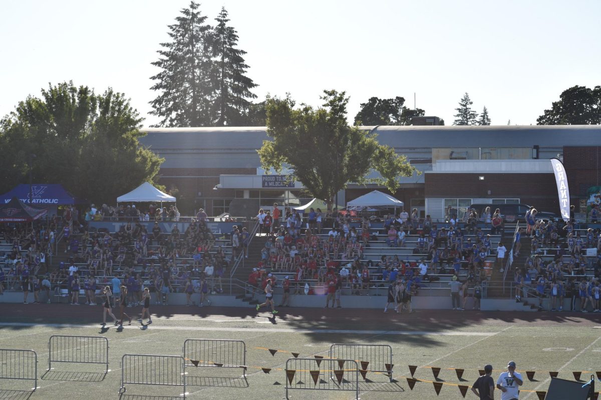 The stands are packed in the opposite stands in anticipation for the night meet. It was around 85 degrees to start the meet.