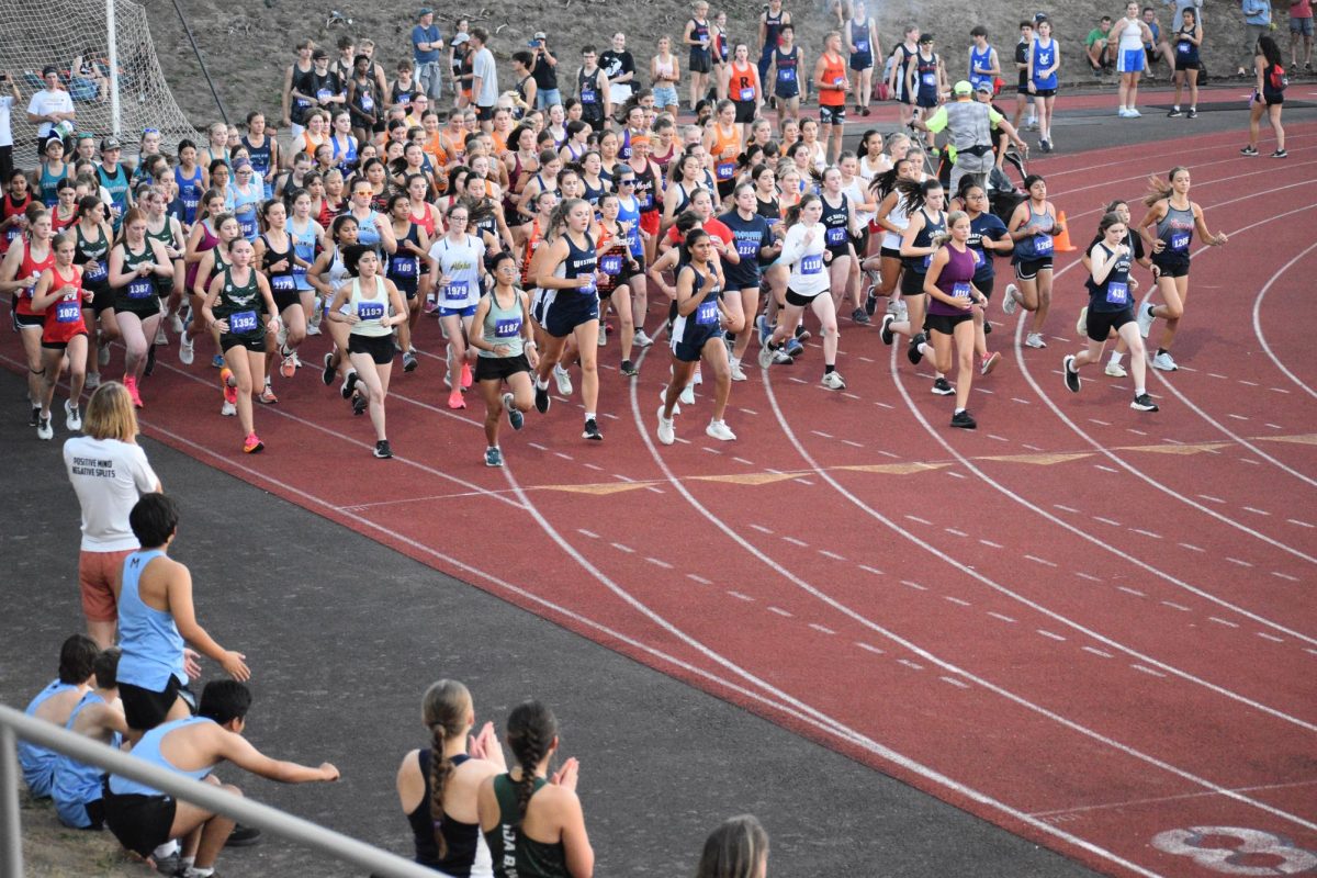 The girls Varsity starts the first of there races. Each race starts at the starting line and ends at the west end zone.