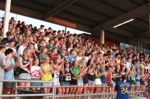 The Wilsonville student section in action cheering on the football team. The electrifying cheers motivate the players.