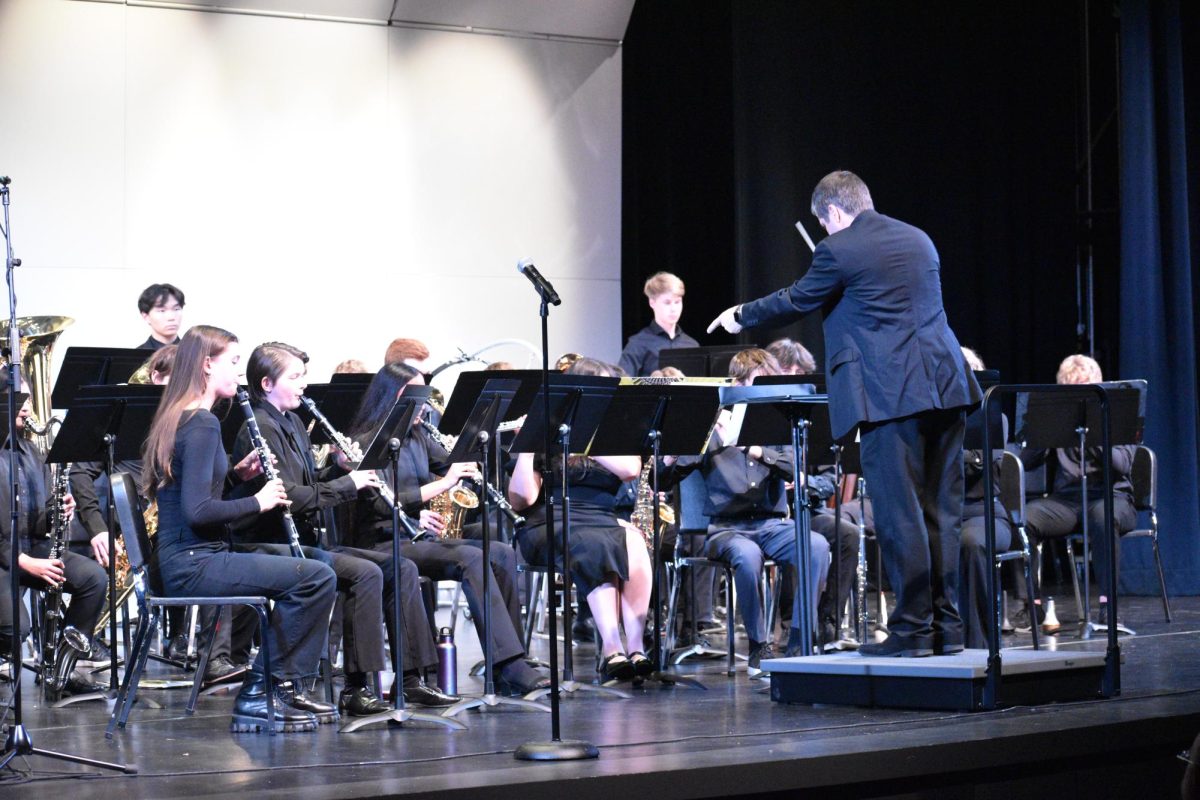 Chad Davies conducts the group, every member of the band focusing on his direction. While Davies does guide throughout the concert, students have also practiced to a point of knowing the song. 