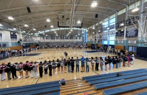 Students at FCA gather to pray during lunch. All grades meet to worship once a week.