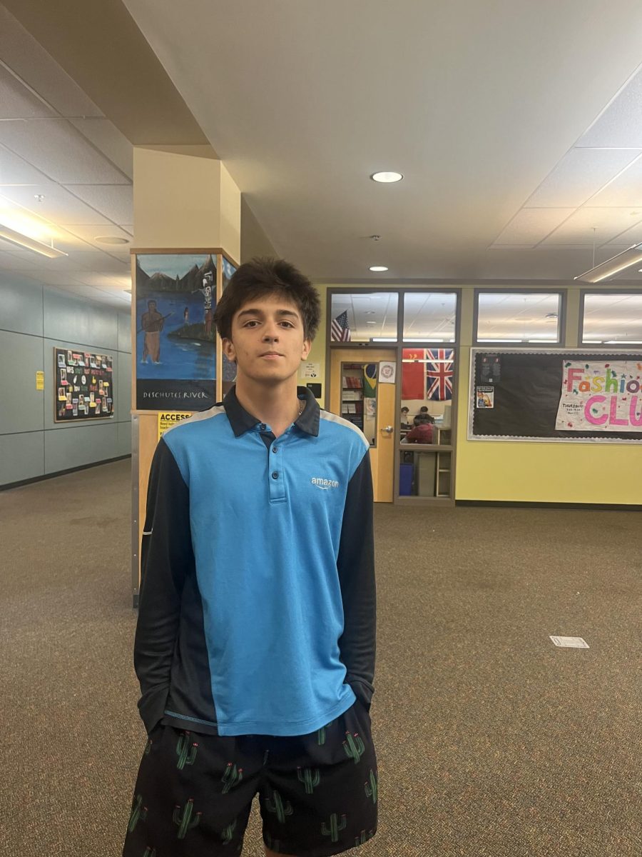 Ayoub poses in the Wilsonville halls after being interviewed by Pattalochi. 