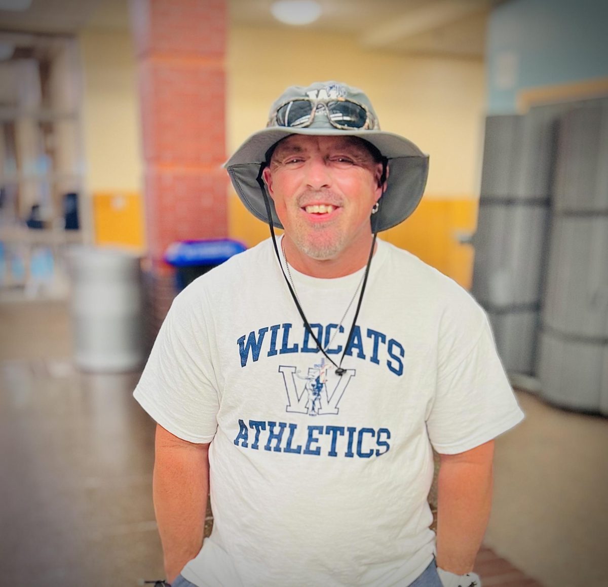 One of many custodians, Tyson poses for a photo as he's interviewed about his career journey and experience at Wilsonville. Wilsonville High School is blessed by passionate faculty who genuinely care about people both as individuals, and a student body whole. 