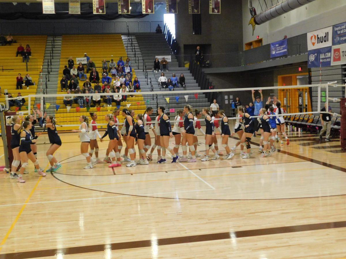 Wilsonville and Churchill give each other high fives before the game begins. Wishing each other good luck.