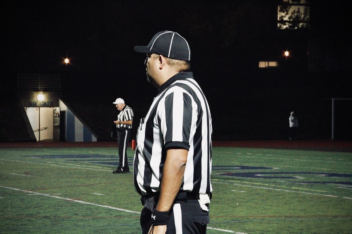 Referee stands around the Cat's 40 yard line, discerning each play. Today, the referee shortage is nothing to take advantage of. Student athletes are especially grateful for officials who make games possible. 