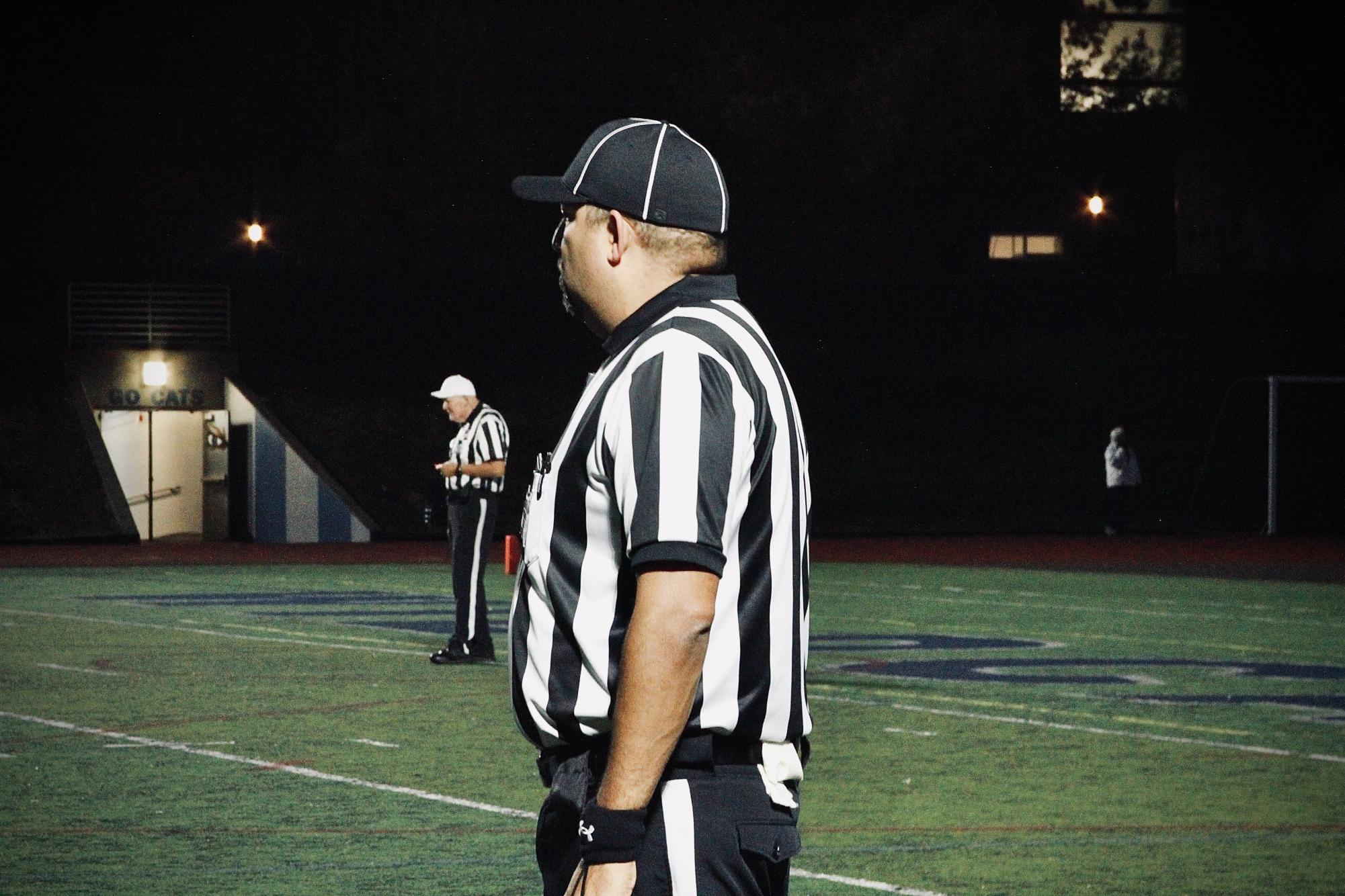 Referee stands around the Cat's 40 yard line, discerning each play. Today, the referee shortage is nothing to take advantage of. Student athletes are especially grateful for officials who make games possible. 