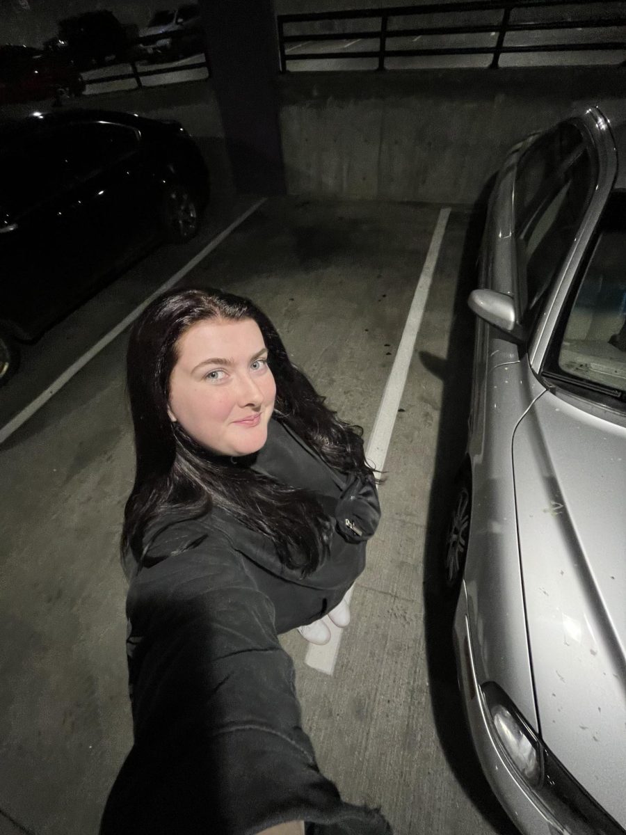 Senior Maya Saunders stands outside her car near “The Streets of Tanasbourne” in Hillsboro. Photo provided by Maya Saunders.