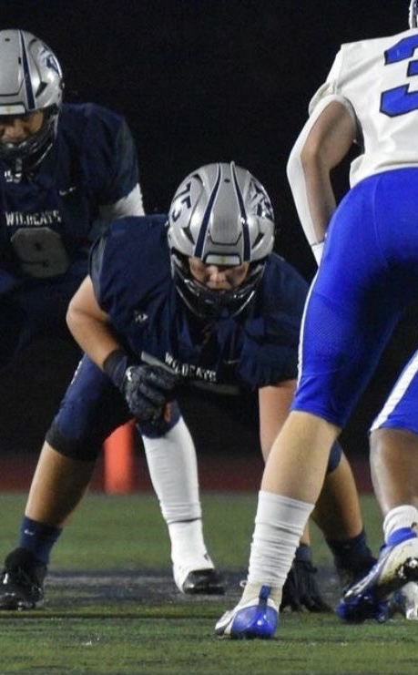 Junior Jared Elia lines up at left tackle versus Woodburn. This is Elia’s first year as a varsity starter.