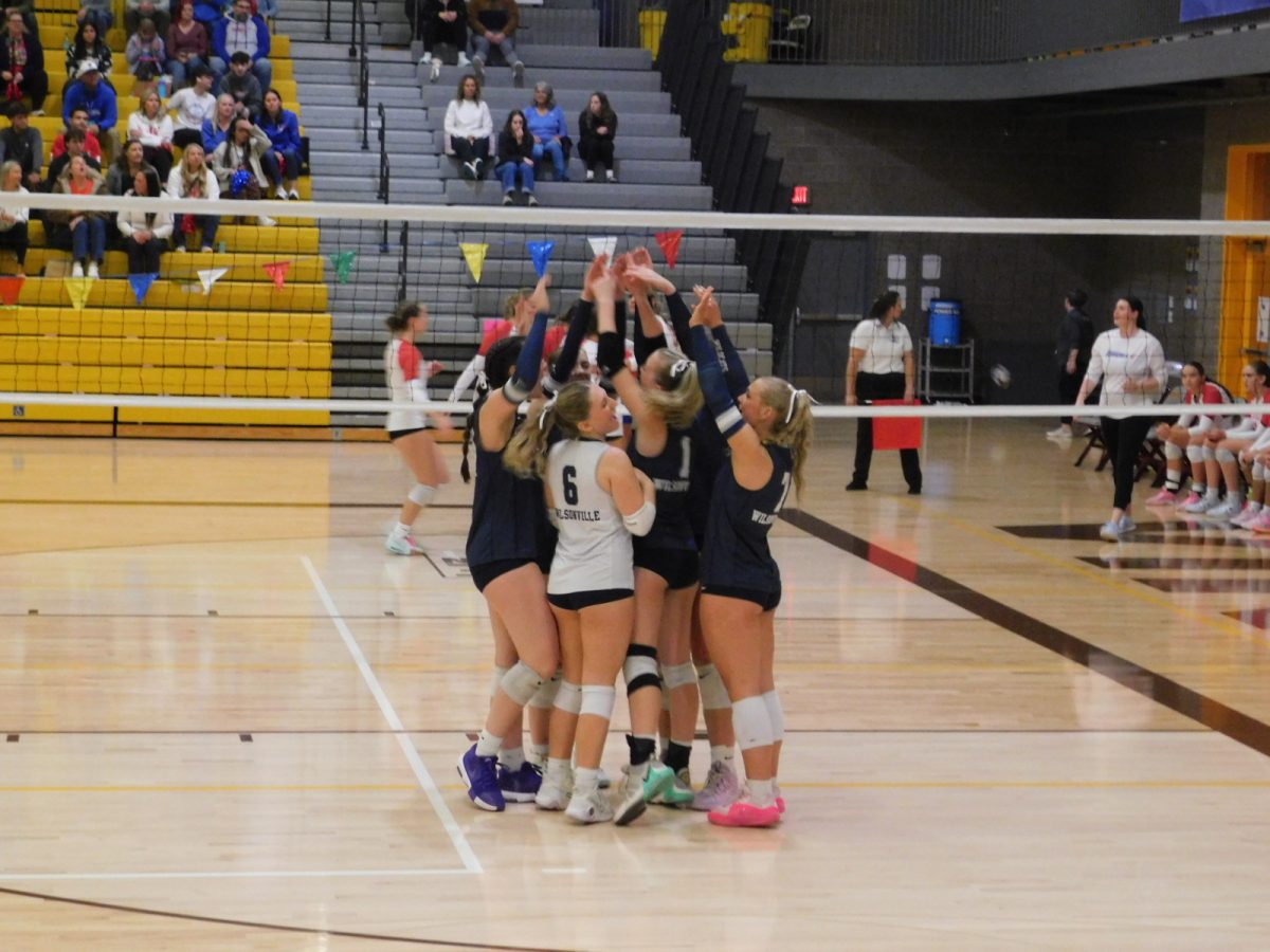 Olivia's serves are too hard to pass getting an ace for Wilsonville. The 6 on the court come together celebrating a great point!