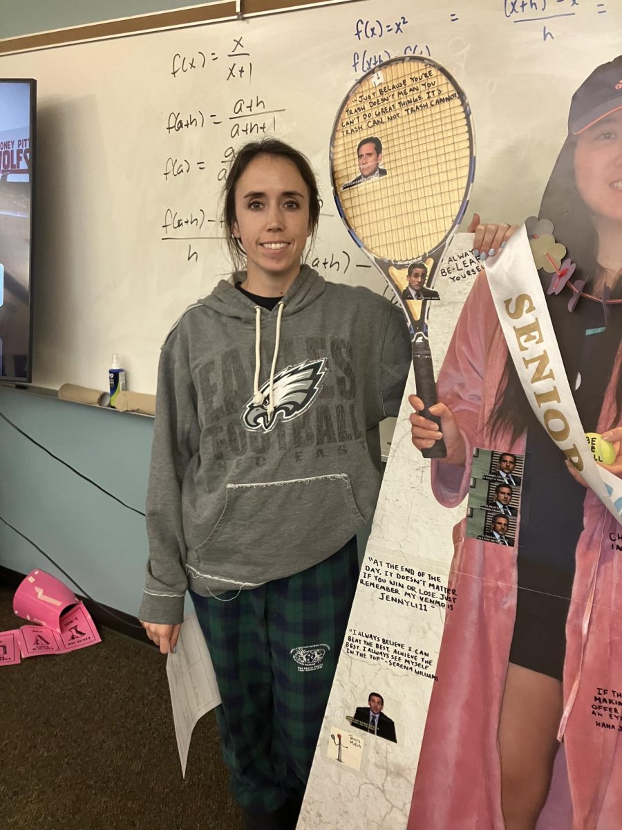 Wilsonville High School math teacher Anna Raschko poses with a life-size cutout of one of her former students. In addition to teaching math, Raschko enjoys the outdoors and tennis.