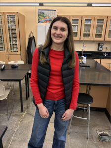 Hannah Beckley, a junior at Wilsonville, poses after AP Chemistry class. Although the classwork has been daunting and time consuming, Beckley attacks the course with academic drive, and plans weekly Starbucks study afternoons with her classmates. 