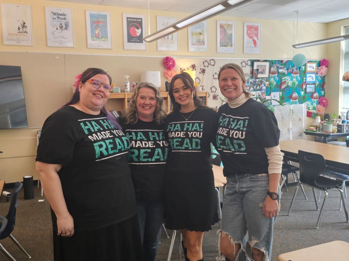 Ms Heaton stands in the between Selena Huggins to her left and Ms. Pattishall and Ms. Kenzie on the right. These four teachers make a large impact on the language arts department at the school and district.