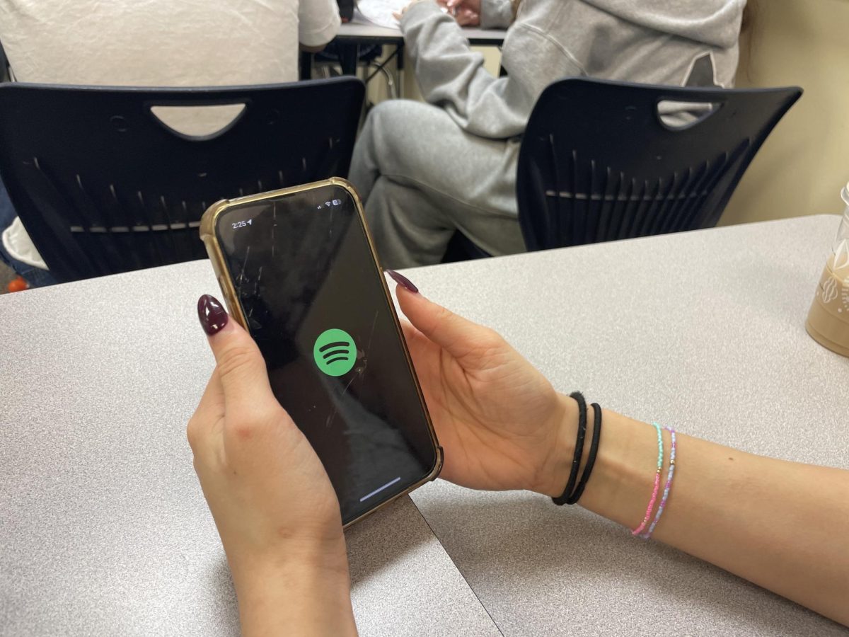 Sophia Lopez, a junior at Wilsonville, opens her phone to view Spotify. Loaded with over thousands of songs, it's a common app among high school students trying to lock into classes or enjoy music.