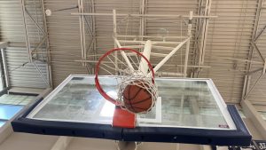 Basketball swooshes through the net, rounding the home team up by two points. From underneath the hoop, this perspective of the game is exhilarating.