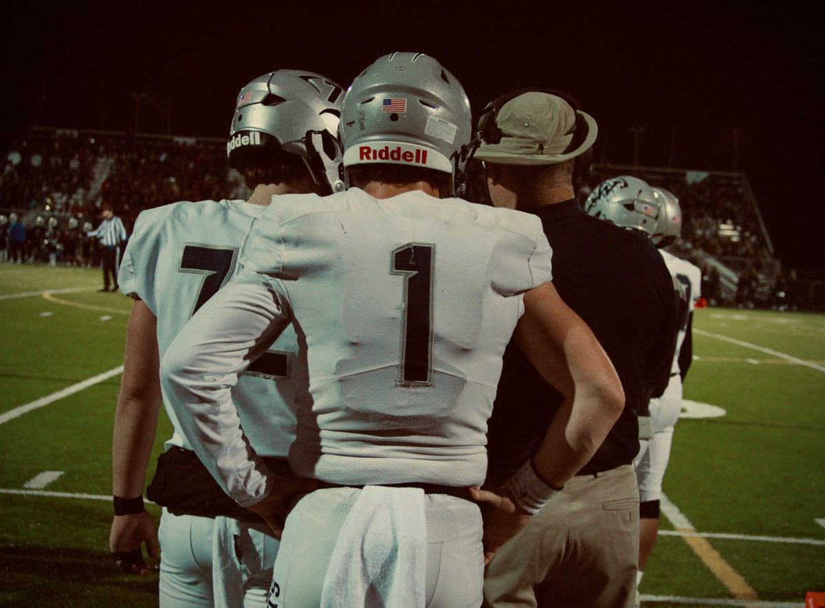 Mark Weipert wearing jersey #1 playing for the Wilsonville High School varsity football team. Even playing in the 5A division gave him enough looks to reach his end goal, playing for the University of Oregon. 