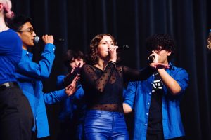 Erin Lauthner performs Feel It Still at ICHSA. Soul'd Out members accompany her voice as she sings lead vocals. 