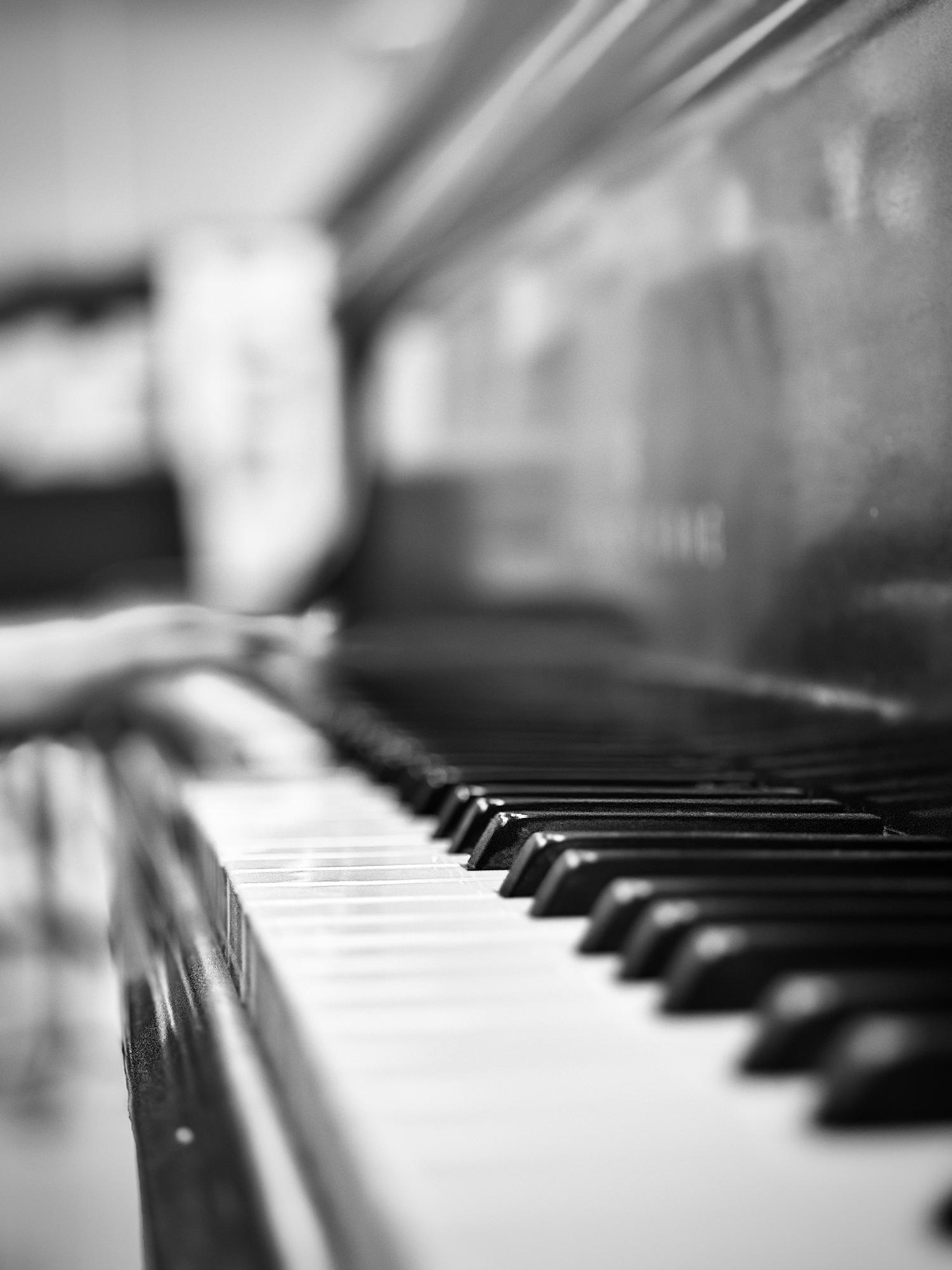 Andrea Ormsby delicately plays the piano set up in the choir room. While many choir students are vastly talented, it's the job of the choral leader to kick off each song with piano tempo and rhythm. 