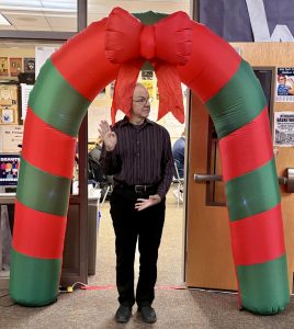 Fitz stands in front of the most important part of the Senior Hallway. The beautifying archway featuring its red jumbo bow captures what the Holiday Season really means to the Seniors. They put a lot of hard work into their poarch and it payed off.
