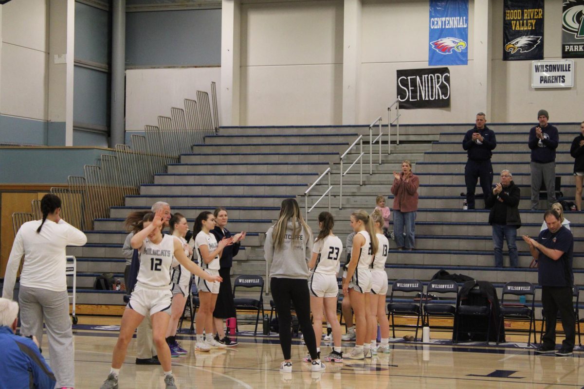 During the starting lineup announcements, forward Audrey Counts dabs coming out of the team tunnel. As a senior, Counts is a crucial leader in the locker room and on the court.