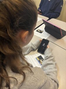 A student scrolling through TikTok. TikTok is very popular with students at Wilsonville.