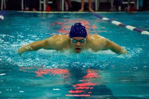 Senior Steven Khamvongsa preforms the butterfly stroke at his respected distance. OSAA swimming offers four different strokes for athletes to choose from.