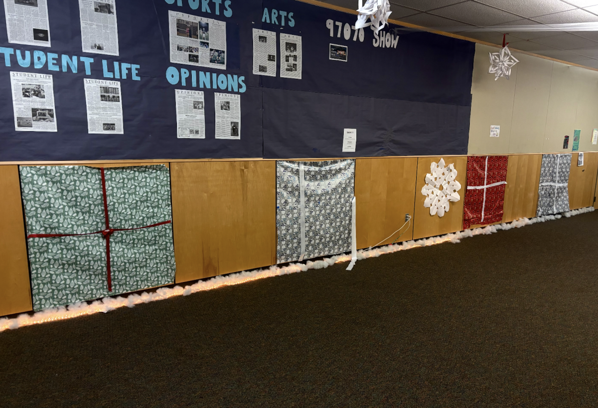 Taking a deeper dive into the senior's hallway, we can note the once beautifully decorated walls which represent presents. However, as the week ended and the presents were forgotten about, they began to crumble altogether, represented by this middle present here. 