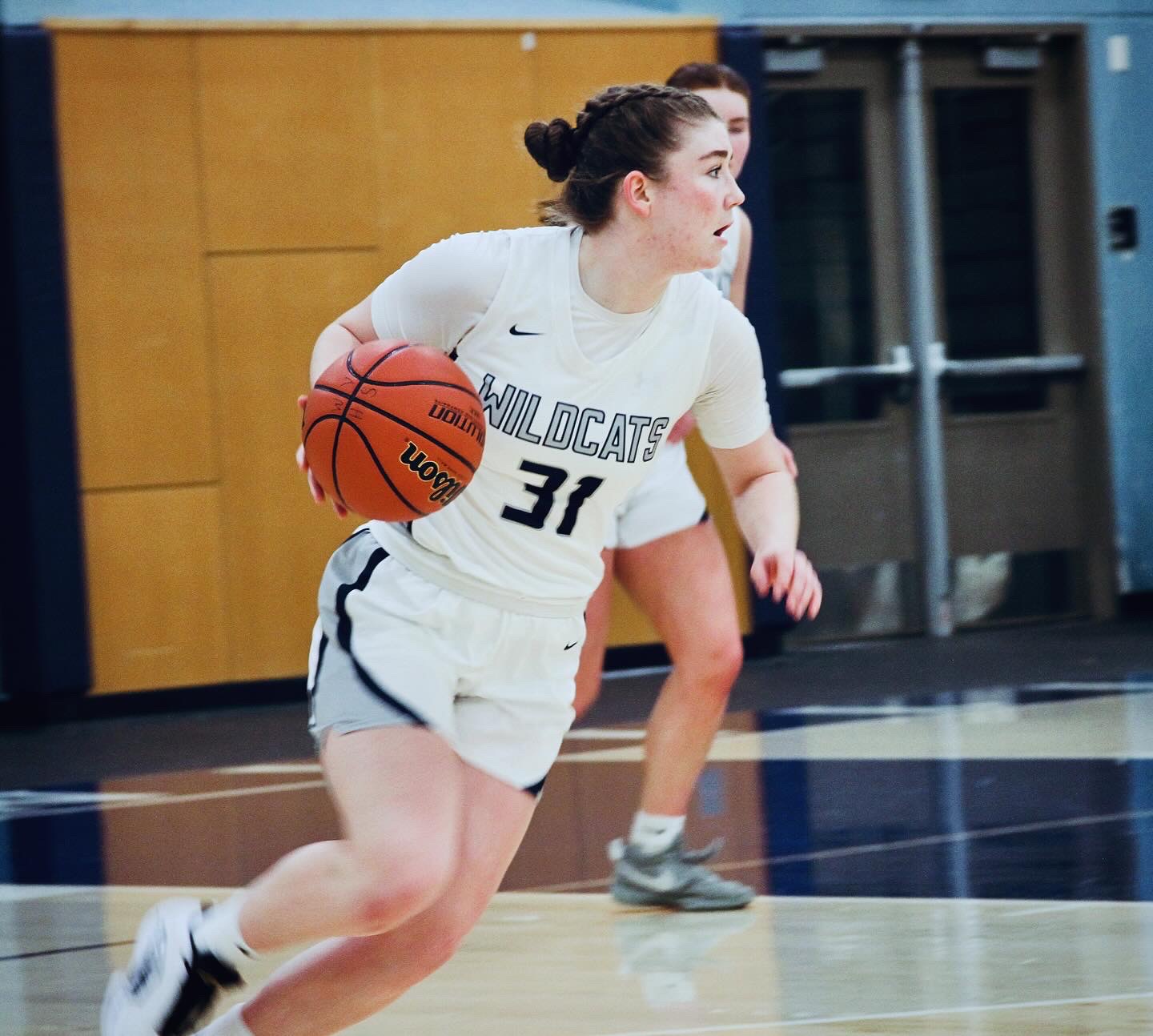 Moultrie brings the ball up the court, confidently dodging defenders and swerving towards the hoop. Wilsonville is known for strong outlet passes that help the teach out-run opponents and send the ball towards the rim quickly. 