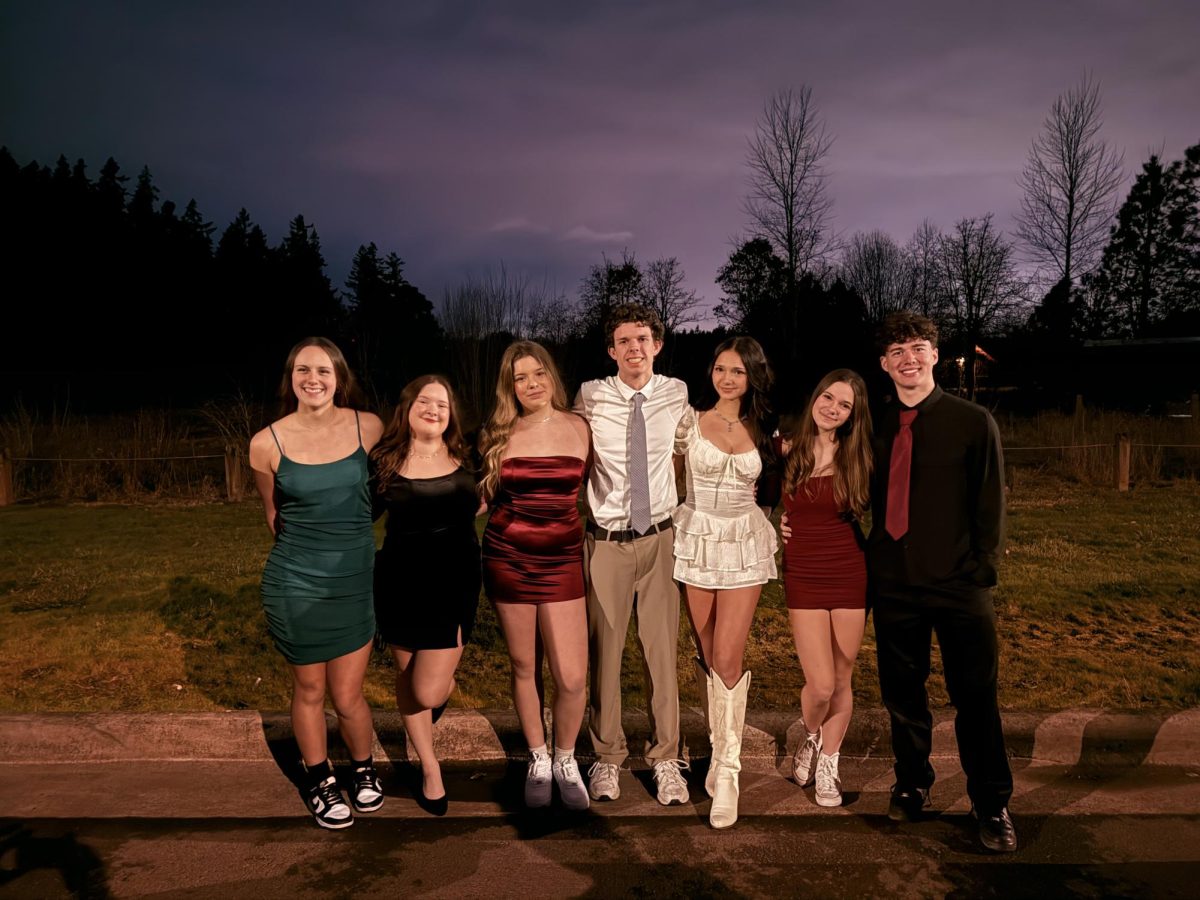 A group of Wilsonville students dressed up and ready for Winter Formal. Like many other friend groups, they took photos before the dance began.