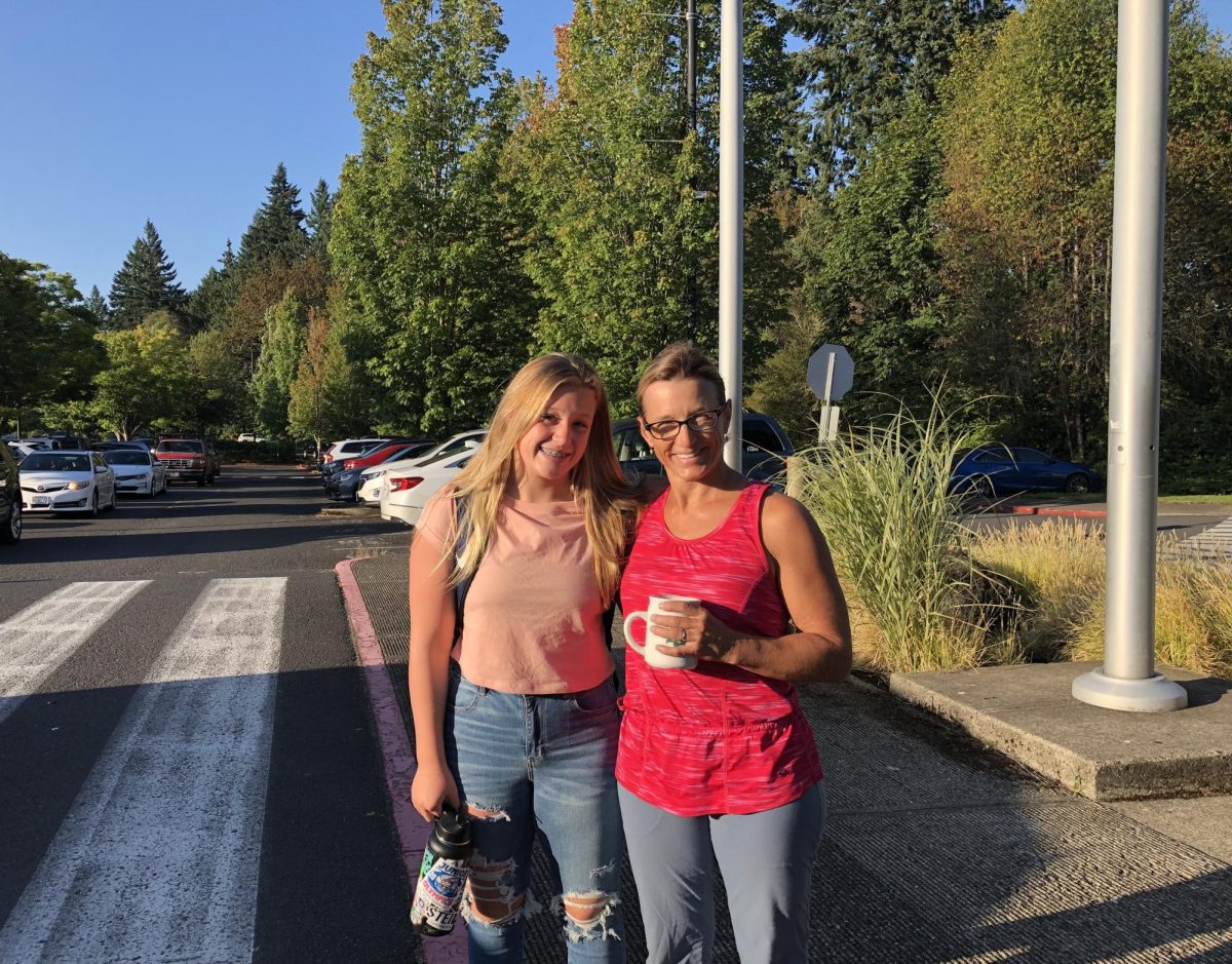 Photo of Donna Parry with her daughter Olivia, who was a former student at WHS. Mrs. Parry shows her support by dropping their daughter off on her first day of freshman year. 