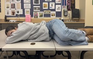 A student takes a nap at school. Students are constantly falling asleep at school and napping immediately when they get home. Students are prone to sleep deprivation.