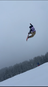 Freshman Cooper Sanders flying 
through the air after hitting a big jump. The thrill of the jump mixed with the crisp mountain air is enough to bring him chills. 