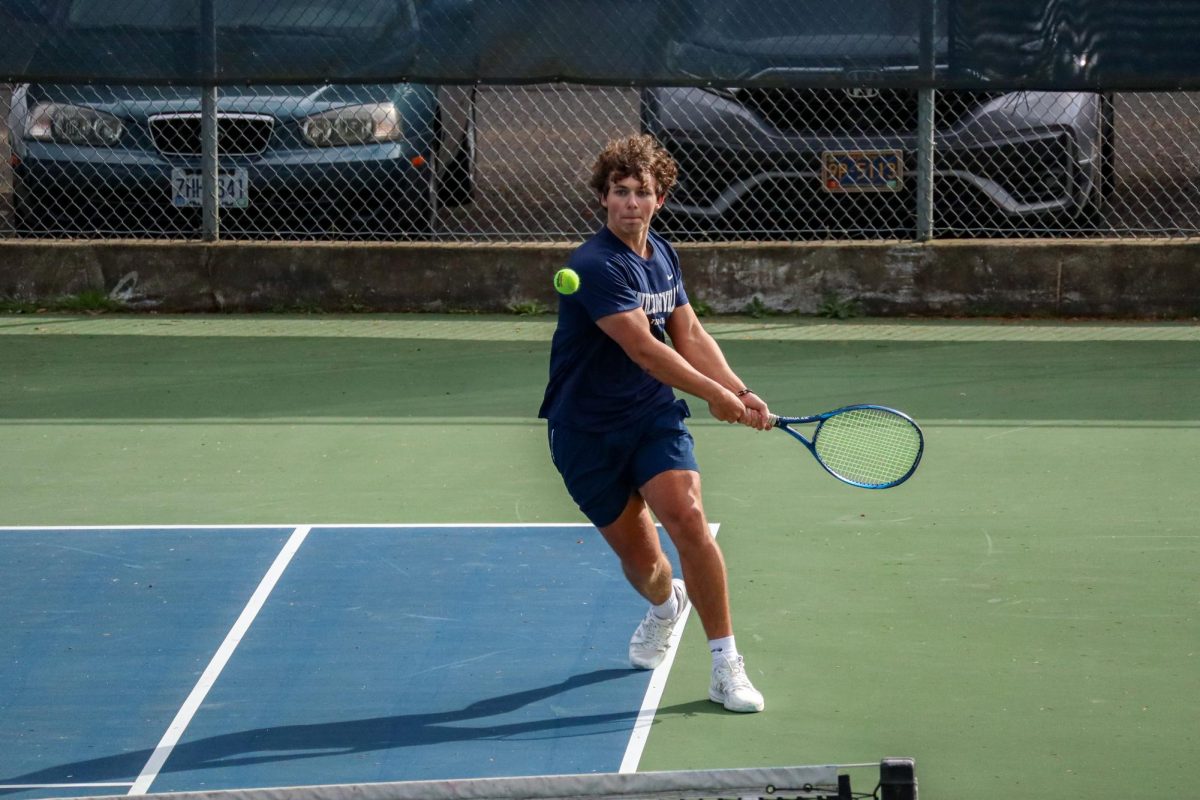 Senior JJ Bartlett blasts a return.  Bartlett has stepped up to be a leader on this year's squad. 